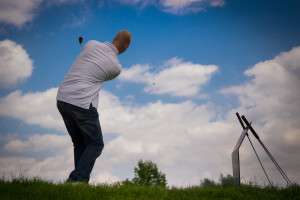 golfer hitting a golf ball